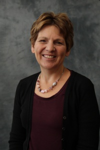 A professional photograph of Kay Foreman.