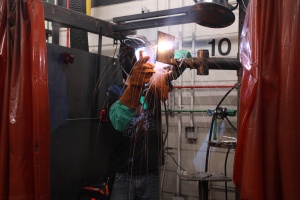 A photograph of a welding student working.