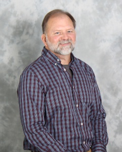 A professional photograph of Neal Haarman.