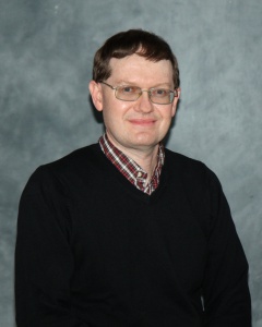 A professional photograph of Joseph Tillman.