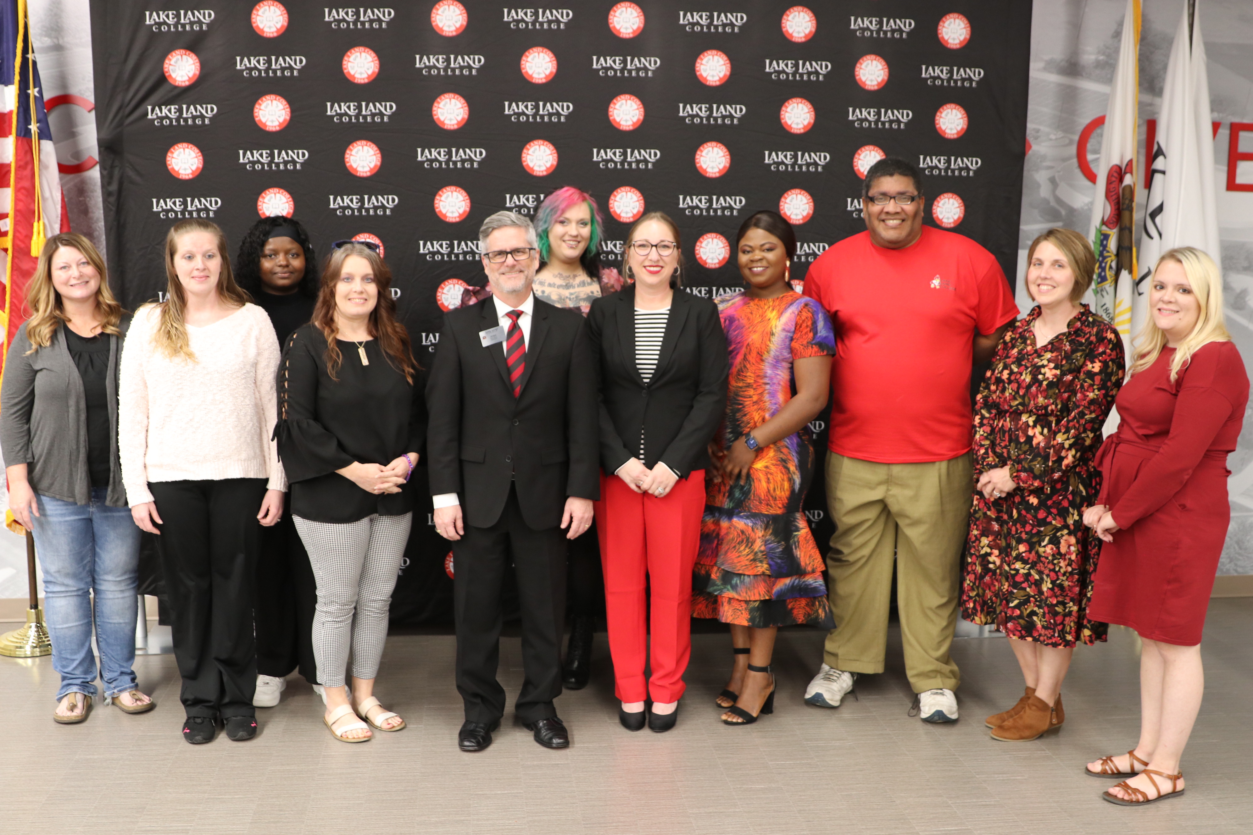 Award nominees posing for group photo with Lake Land College president