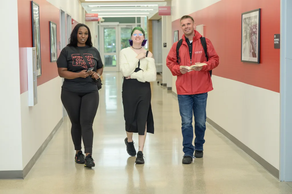 Students walking a hallway in the college