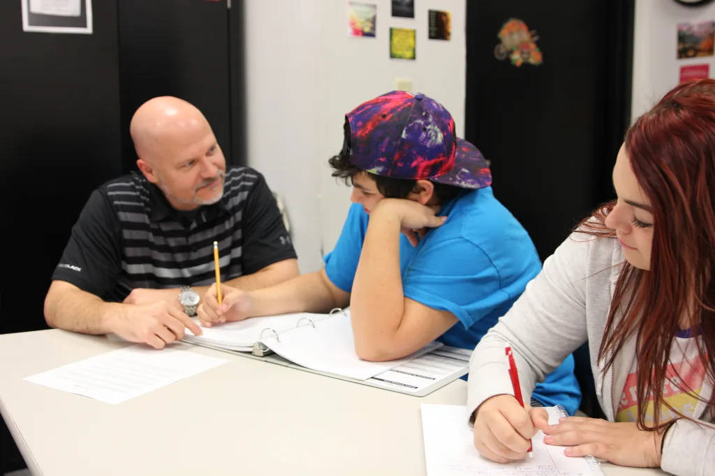 Photo of student's being tutored.