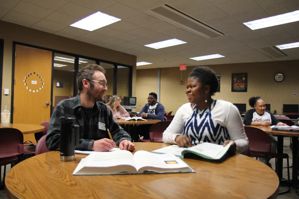 Students conversing and studying