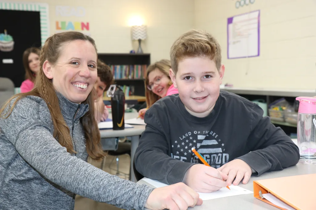 Photo of teacher and student.