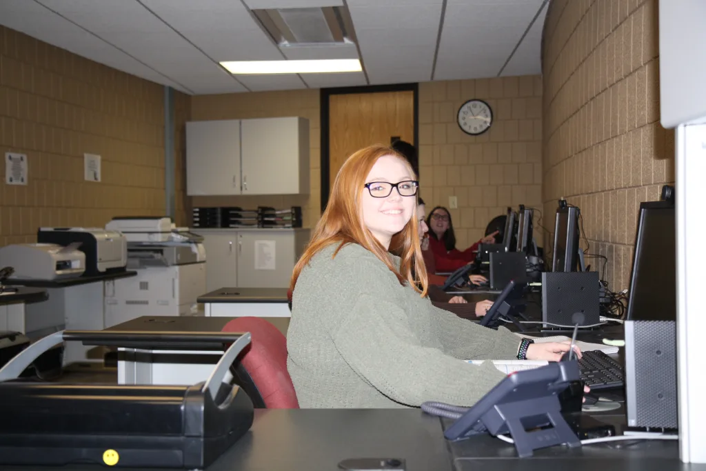 Photo of student in business setting.