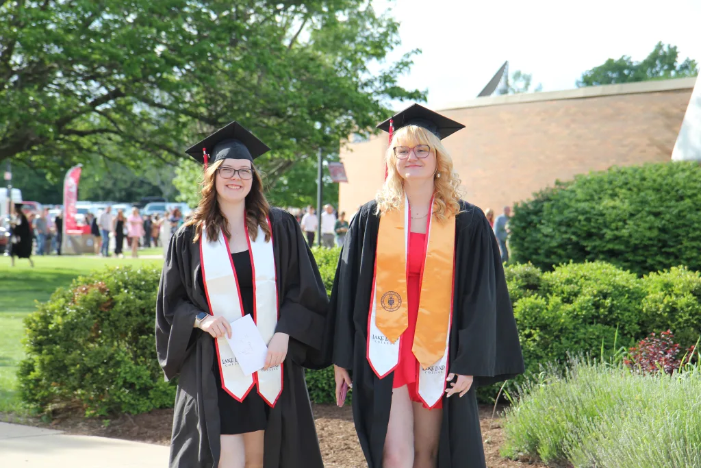 Two graduates walking