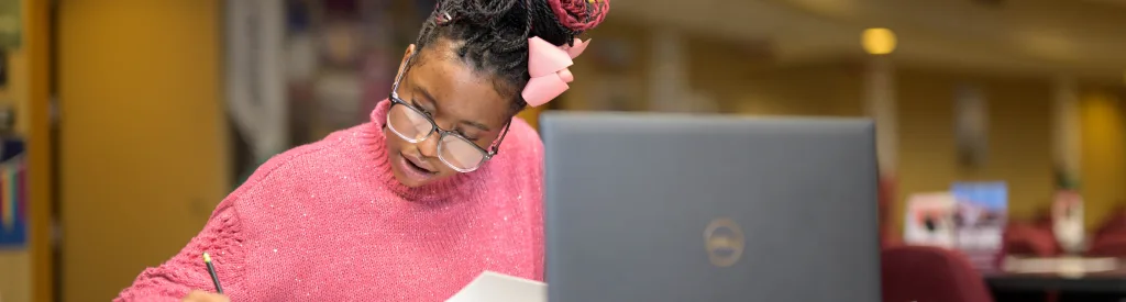 Student working on a laptop.