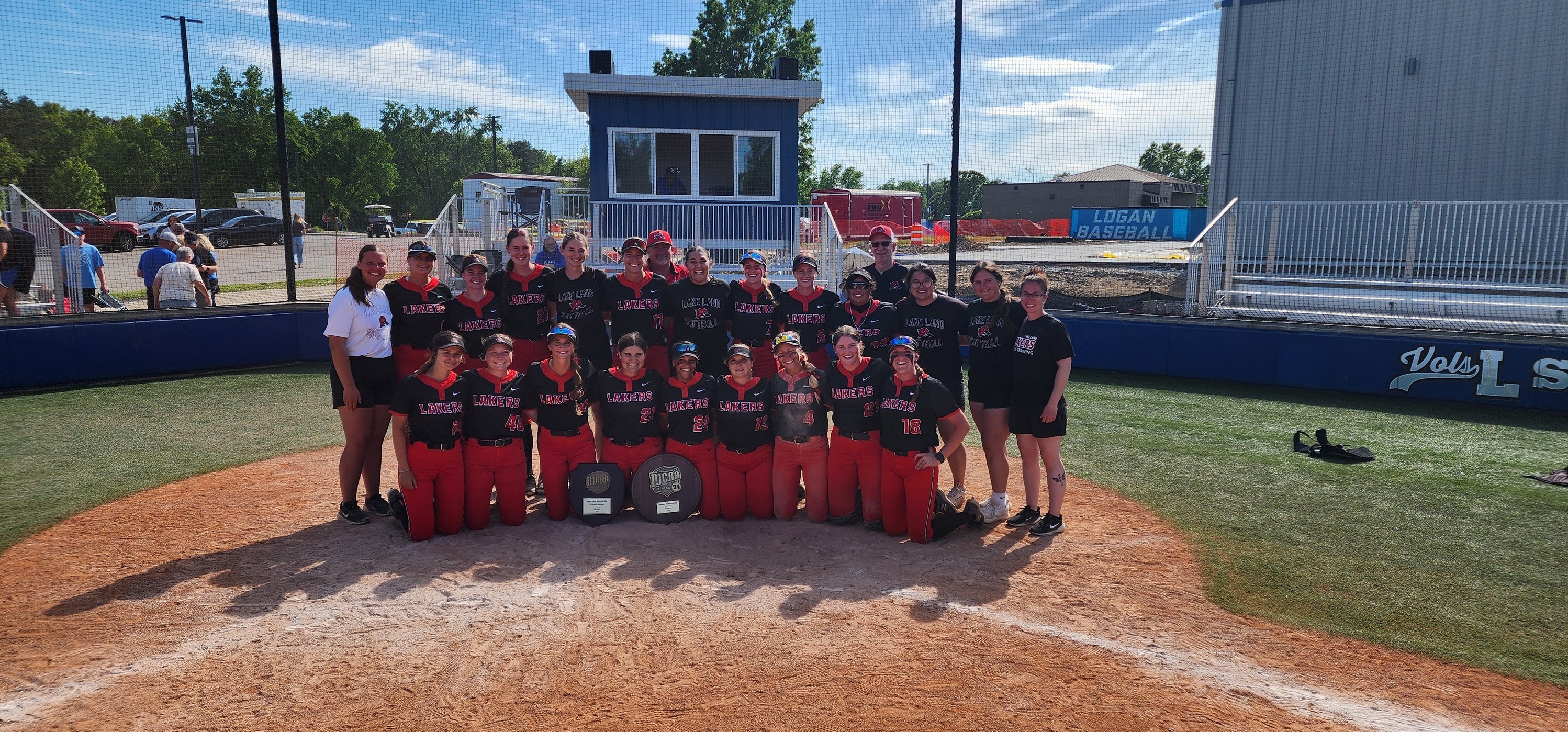 The players and coaches from the Lake Land College softball team gathered following a championship game win. 