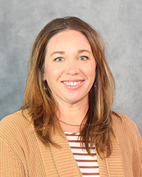 A professional photograph of Samantha Webster.