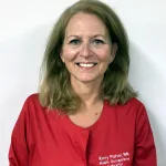 Woman smiling and posing for a photo