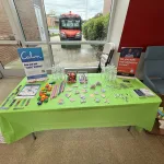 Decorative table with snacks, drinks, and promotional material for mental health awareness