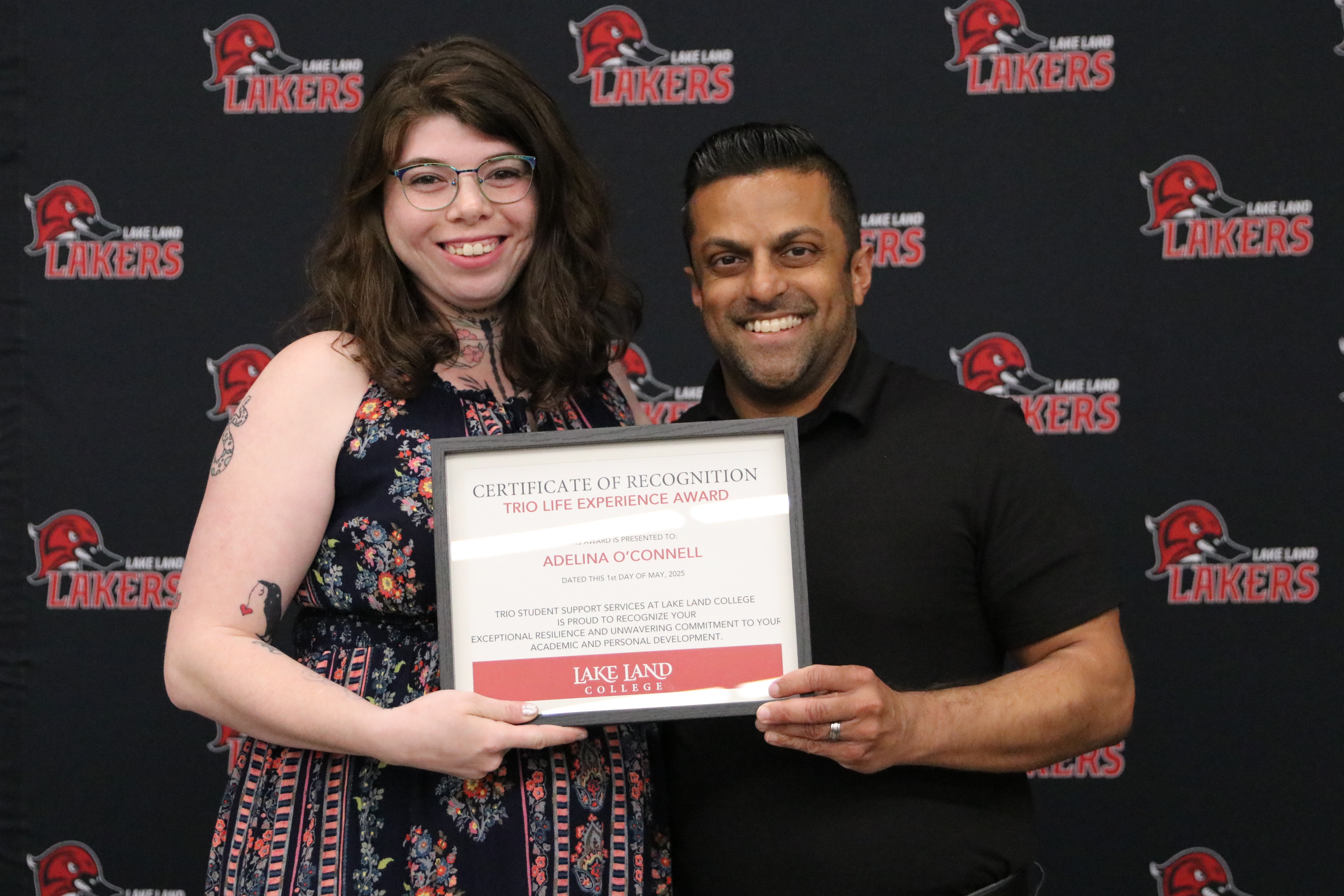 A student receiving an award during a banquet.