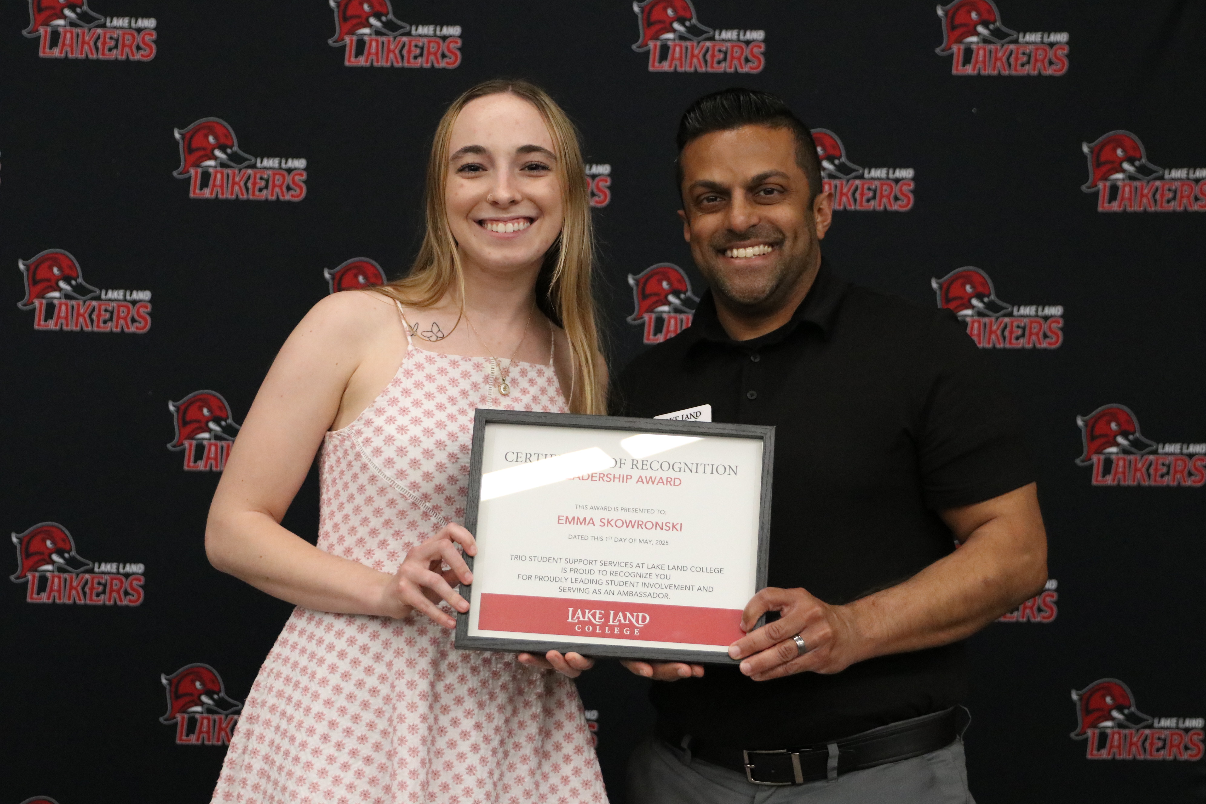 A student receiving an award during a banquet.