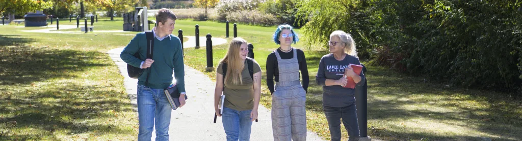 Group of students walking outside on campus