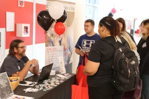 An LLC staff member sharing info at Welcome Week