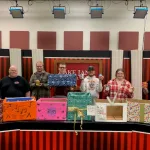 Members of the Lake Land College Broadcasting Club with the donation boxes they made for the 19th annual Broadcasting Club Food Drive.