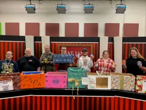 Members of the Lake Land College Broadcasting Club with the donation boxes they made for the 19th annual Broadcasting Club Food Drive.