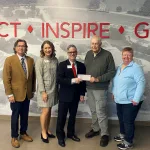 Dan Icenogle and Debbie Kramer, the cousins of Randolph “Randy” Adkins, present Lake Land College with the second-largest cash gift in the history of the College’s Foundation.