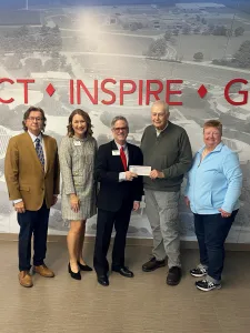 Dan Icenogle and Debbie Kramer, the cousins of Randolph “Randy” Adkins, present Lake Land College with the second-largest cash gift in the history of the College’s Foundation.