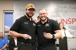 Two EMS graduates, Grayson Thomas and Brandon Balaco, with the awards they received during the Fall 2025 EMS Pinning Ceremony.