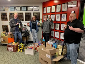 Members of the Lake Land College Broadcasting Club with the donations they collected for the club’s 19th annual food drive.