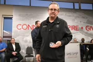 EMS graduate Curtis Robinson receiving an award during the Fall 2025 EMS Pinning Ceremony.