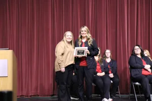 Nursing graduate Brandy Watson receiving the Heart of Positivity Award during the Fall 2025 LPN to ADN pinning ceremony.