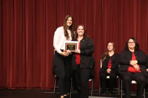 Nursing graduate Jessica Williamson receiving the Patient Advocate Award during the Fall 2025 LPN to ADN graduation ceremony.