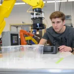 Photo showing a student in a manufacturing environment