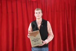 Ag student Joseph Faulkner receives the 2025-2026 John Deere Tech High GPA Award.