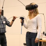 An image of Special Assistant to the Vice President for Academic Services Scott Rhine demonstrating Lake Land’s virtual reality training equipment along with a high school student volunteer during the College’s first-ever Laker Day at the new Effingham Technology Center.