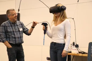 An image of Special Assistant to the Vice President for Academic Services Scott Rhine demonstrating Lake Land’s virtual reality training equipment along with a high school student volunteer during the College’s first-ever Laker Day at the new Effingham Technology Center. 