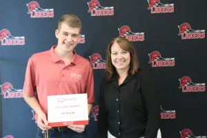 A student being recognized for completing honors courses at an annual banquet.