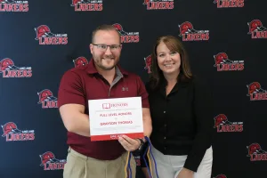 A student being recognized for completing honors courses at an annual banquet.