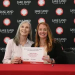 Lake Land Apprentice and staff member during signing ceremony
