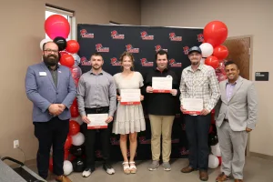 Two Lake Land College TRIO Staff members recognizing the four students who were nominated for the Outstanding TRIO Advocate Award.