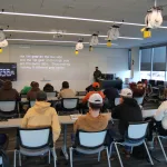 A CDL teacher instructing a class of high school students.