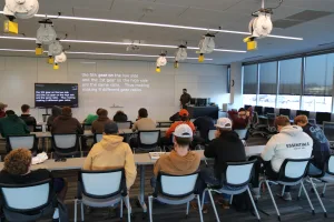 A CDL teacher instructing a class of high school students. 