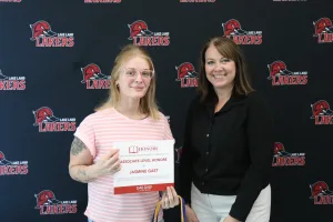 A student being recognized for completing honors courses at an annual banquet.