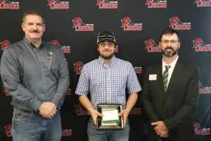 A John Deere Tech graduate being recognized during the annual graduation ceremony.