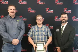 A John Deere Tech graduate being recognized during the annual graduation ceremony.