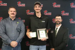 A John Deere Tech graduate being recognized during the annual graduation ceremony.
