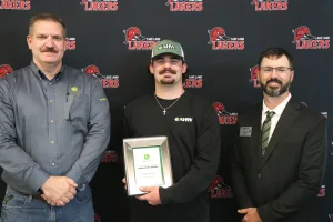 A John Deere Tech graduate being recognized during the annual graduation ceremony.