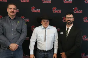 A John Deere Tech graduate being recognized during the annual graduation ceremony.