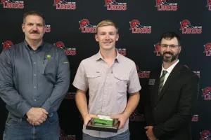 A John Deere Tech graduate being recognized during the annual graduation ceremony.