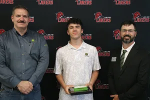 A John Deere Tech graduate being recognized during the annual graduation ceremony.