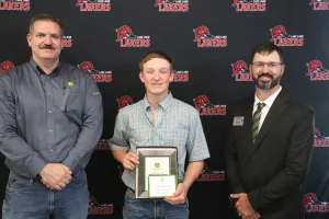 A John Deere Tech graduate being recognized during the annual graduation ceremony.