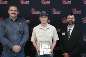 A John Deere Tech graduate being recognized during the annual graduation ceremony.