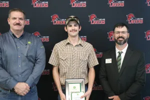 A John Deere Tech graduate being recognized during the annual graduation ceremony.
